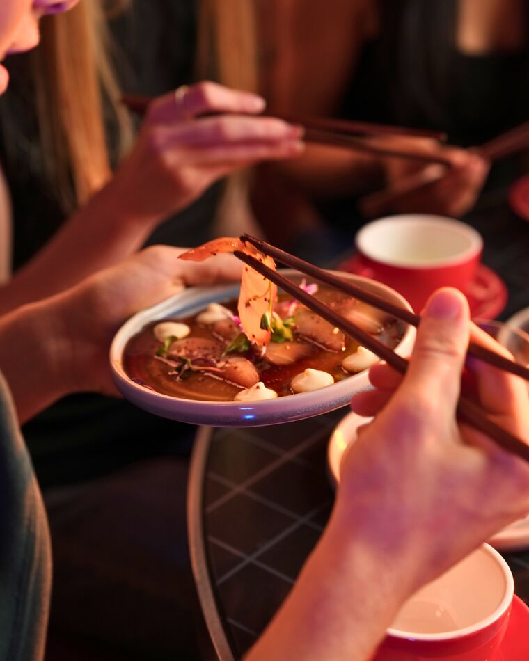 Friends sharing plates around the table