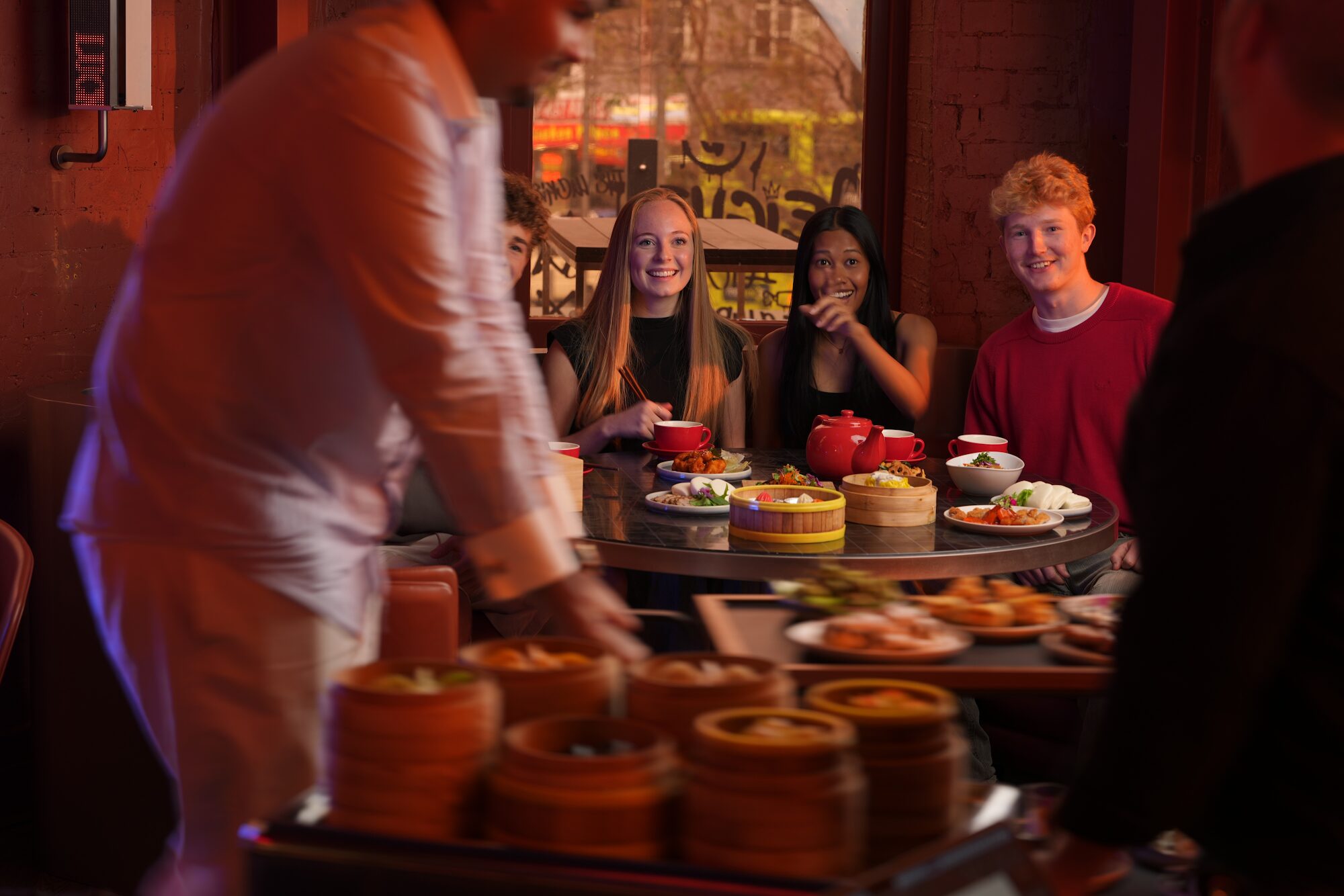 Friends sharing bottomless yum cha at Lucky 8 Wellington on Courtenay Place